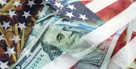 Twenty dollar bill overlaid on American flag