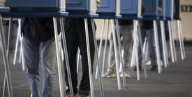 voting booths, legs only visible