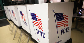Voting booths with American flag
