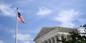 A flag flies in front of the U.S. Supreme Court