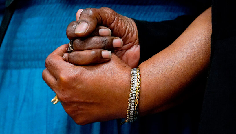 Hands clasped in support