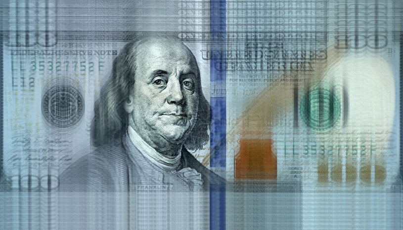 Imagen borrosa de un billete de $100