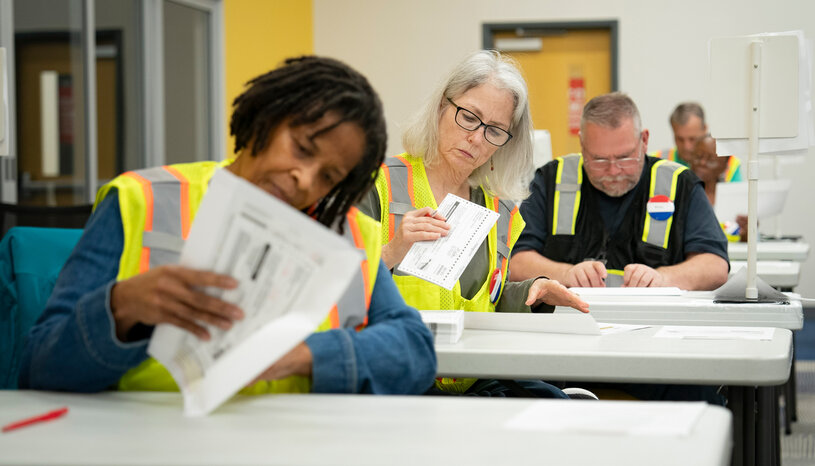 Election workers review ballots