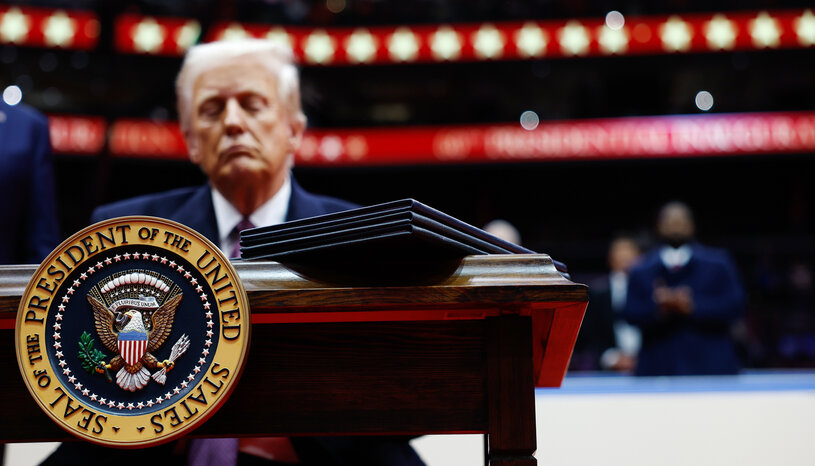 Donald Trump with presidential seal in foreground