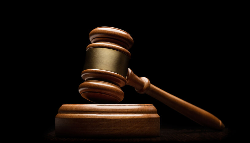 wood gavel against black background