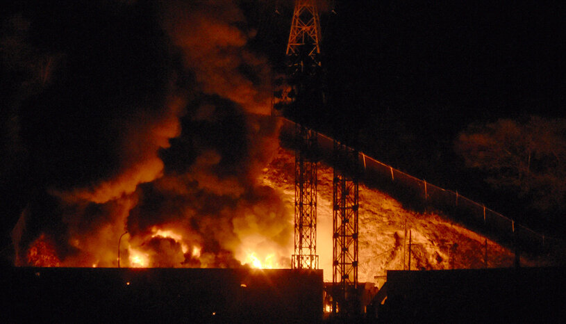 Rig on fire at night