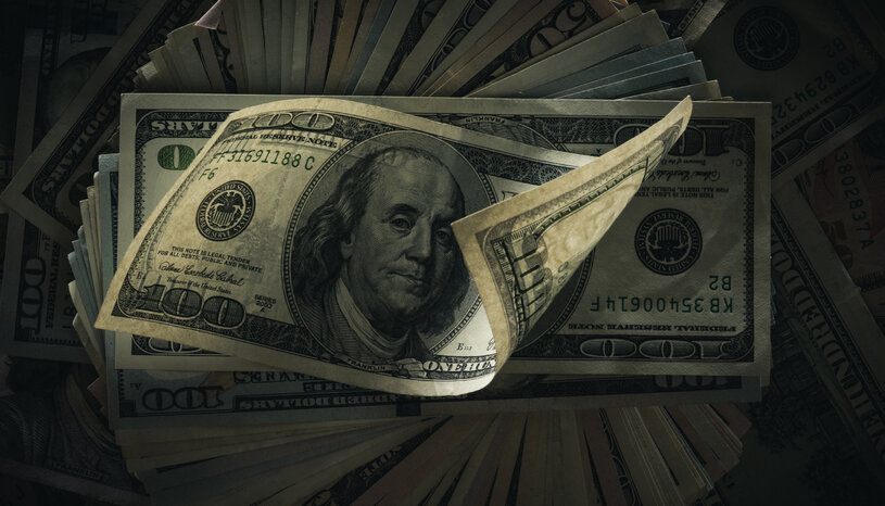 Spread stack of $100 bills