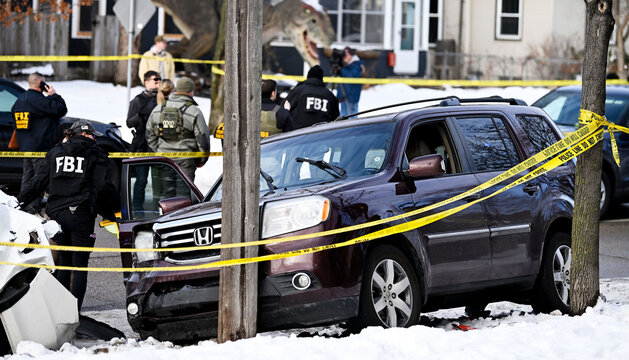 Car of R. Good surrounded by police tape