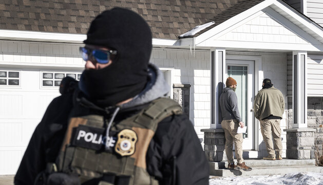 ICE agents outside a private home in Minneapolis