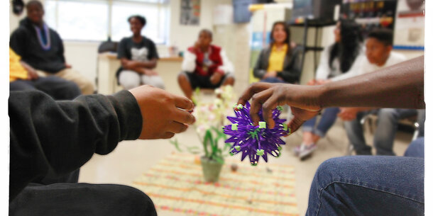 Teens sit in on a group counseling session.