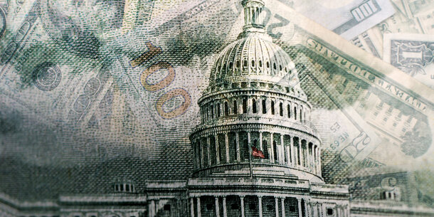 An illustration showing the Capitol Building with superimposed images of various bills and denominations of U.S. currency