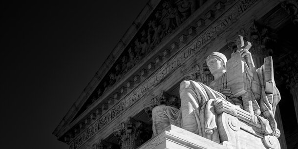 Close-up black and white image of Supreme Court