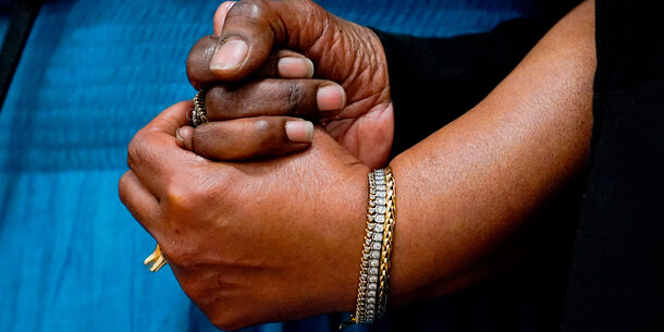 Hands clasped in support
