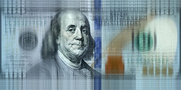 Blurred image of $100 bill