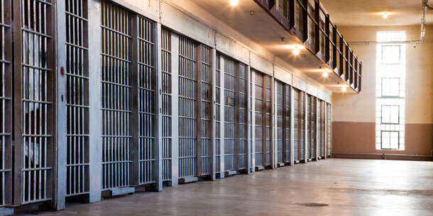 Row of prison cells with bars
