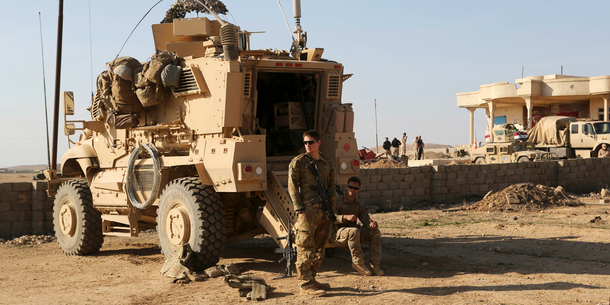 US troop carrier and soldier in Iraq