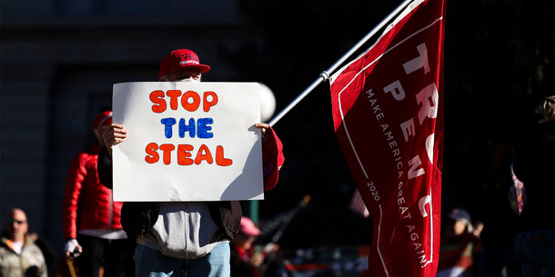 Trump supporter holding a "Stop the Steal" sign
