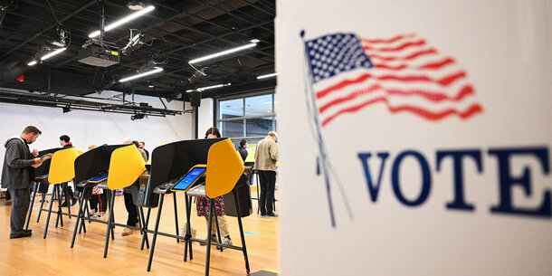 People casting ballots at polling place