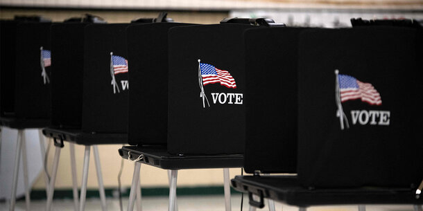 Black voting booths with American flags