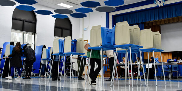 People at voting booths