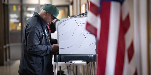 Person at a voting booth