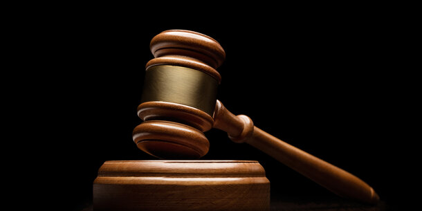 wood gavel against black background