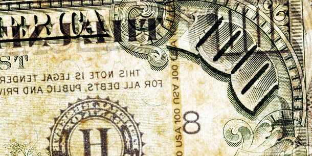 top right corner of $100 bill