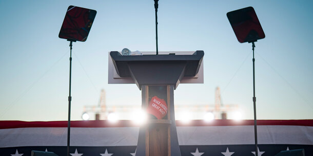 Podium with a MAGA hat