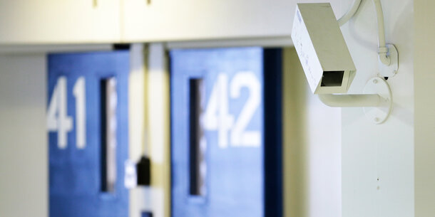 interior of jail with camera and cell doors