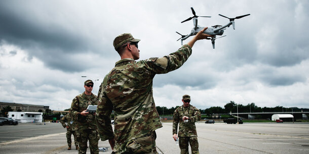 A U.S. soldier launching an armed drone