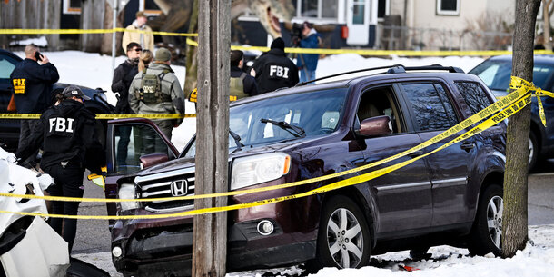 Car of R. Good surrounded by police tape