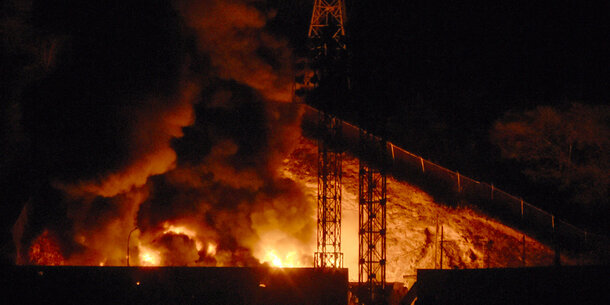 Rig on fire at night