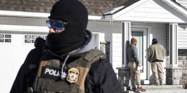 ICE agents outside a private home in Minneapolis