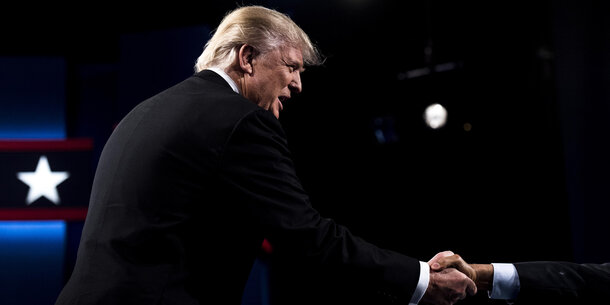 President Trump shaking hands with someone off-camera