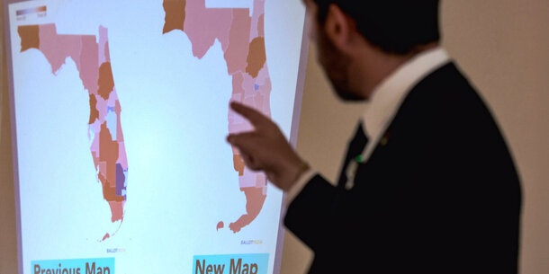 Man looking at proposed Florida congressional maps