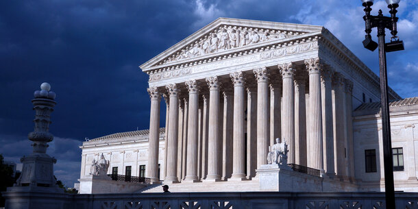 Supreme Court with storm clouds behind