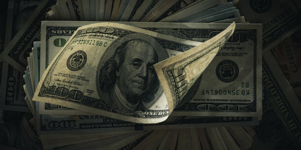 Spread stack of $100 bills