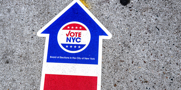 VoteNYC on arrow signage on ground