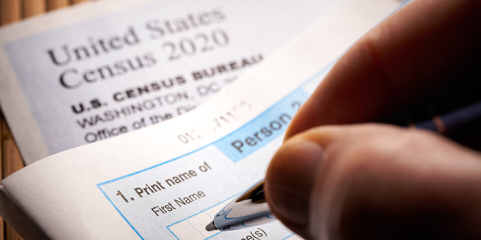 Person filling out census form