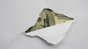 Money hidden behind paper