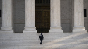 A Supreme Court Police officer walks up the steps at the U.S. Supreme Court on March 16, 2020 in Washington, DC.