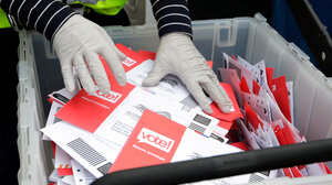 Bin full of mailed votes.
