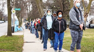 waiting to vote in masks