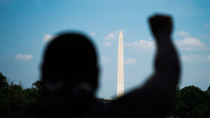 fist raised by Washington Memorial