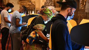 Voters cast their ballots in person on Election Day.