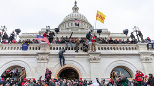 Pro-Trump rioters storm the Capitol.