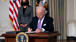 President Joe Biden signing an executive order.