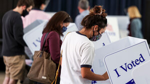 Voter casts ballot.