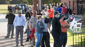 Voters waiting in line to vote. 