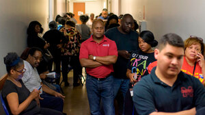 Voters line up at a polling station to cast their ballots during the presidential primary in Houston, Texas on Super Tuesday, March 3, 2020.